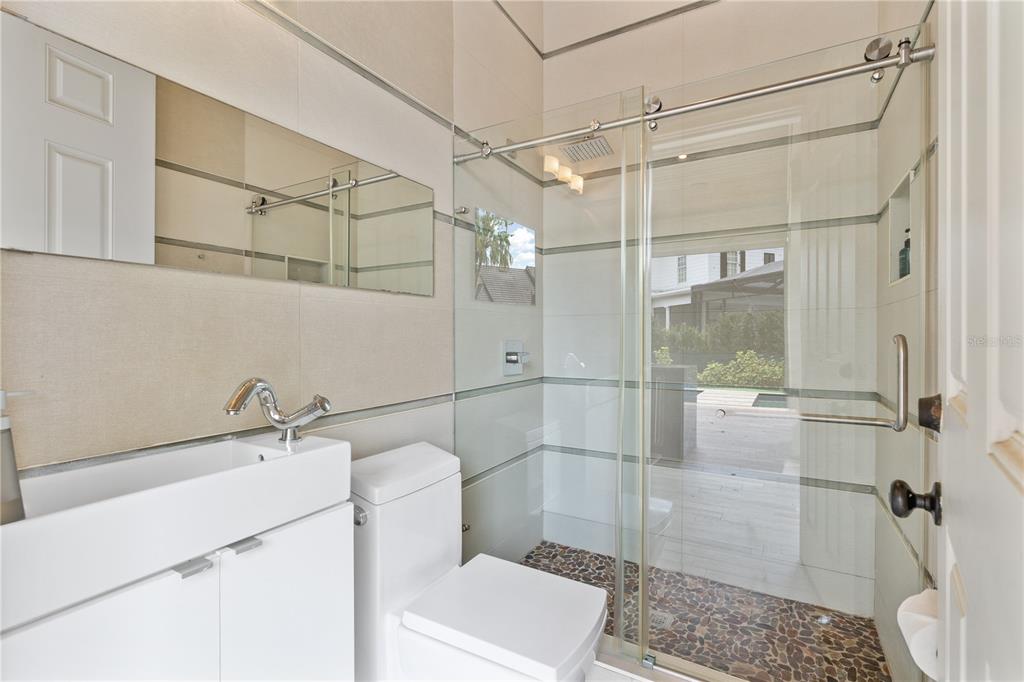 222 Acadia Terrace Celebration, FL 34747 - Photo 58 of 76 a bathroom with a shower and a sink