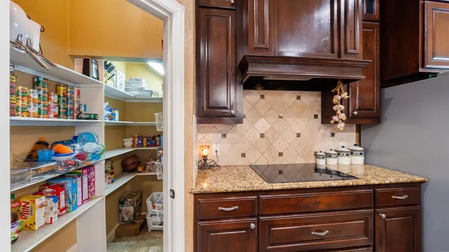 a view of storage and utility room with a sink