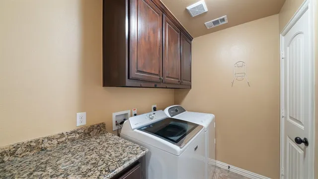 a kitchen with a stove and a microwave