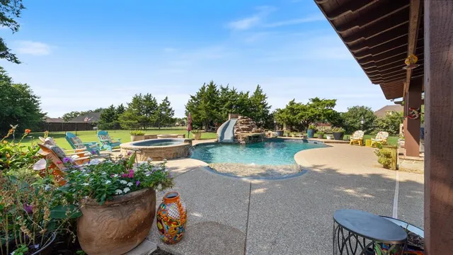 a view of a lake with couches and wooden floor