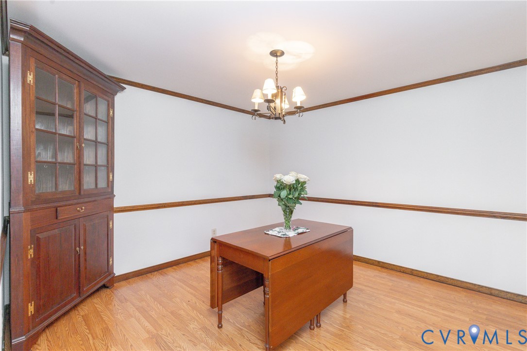617 Rebel Ridge Road Colonial Heights, VA 23834 - Photo 14 of 49 a view of an empty room with wooden floor