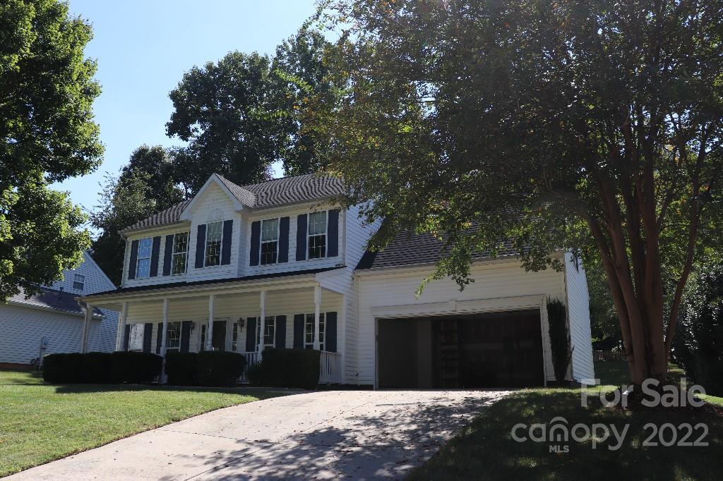 723 West Cheval Drive Fort Mill, SC 29708 - Photo 1 of 14 a front view of a house with a garden