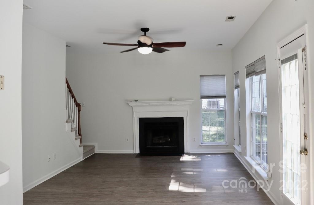 723 West Cheval Drive Fort Mill, SC 29708 - Photo 6 of 14 a view of an empty room with wooden floor fireplace and a window