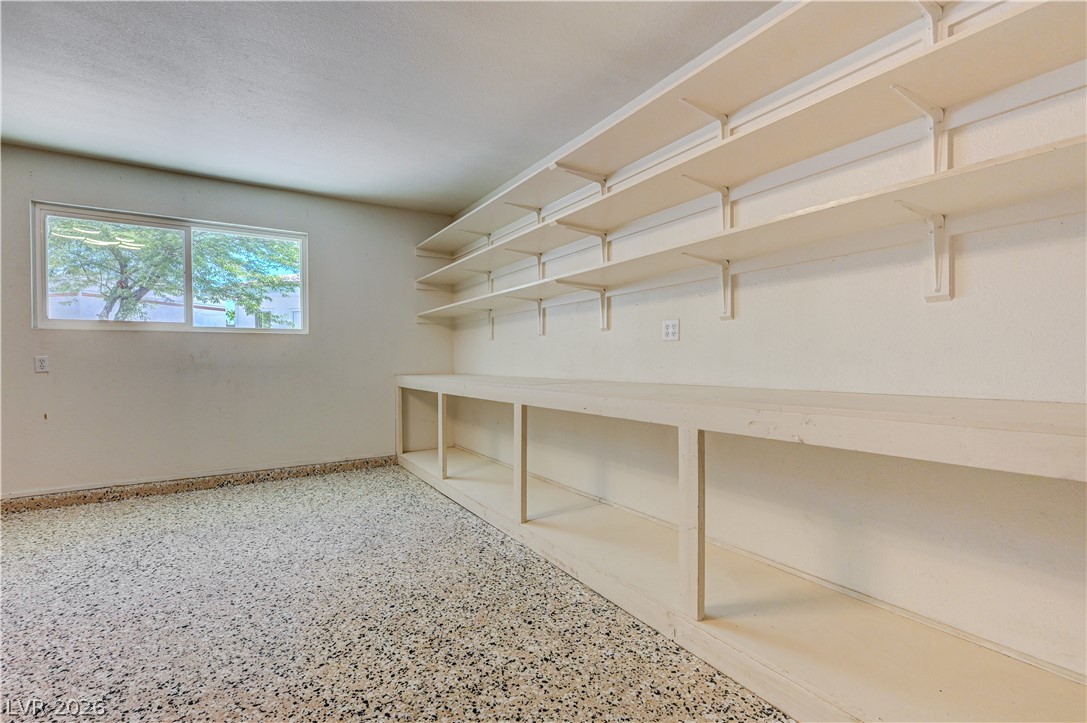 7631 Bermuda Road Las Vegas, NV 89123 - Photo 30 of 64 Ample storage solutions abound in this well-lit room, ideal for organization.