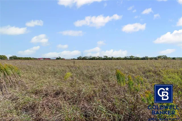 a view of a lake with houses in the back