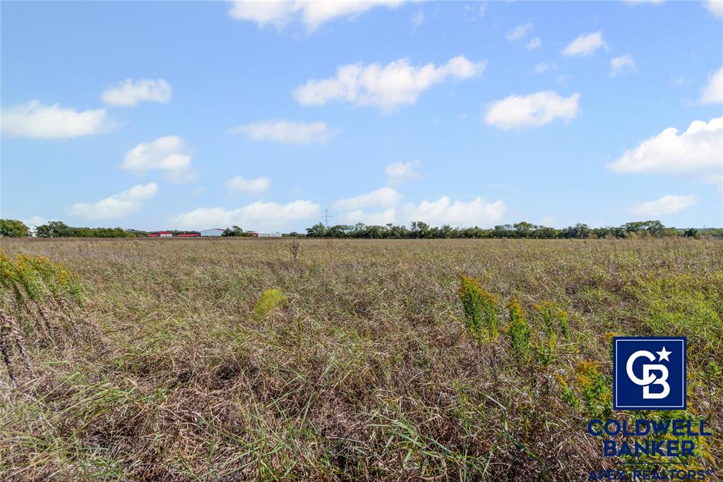 501 Hix Road Cleburne, TX 76031 - Photo 11 of 12 a view of a lake with houses in the back