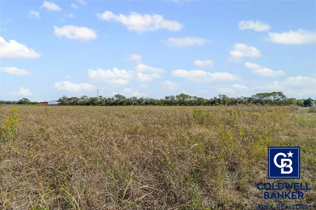 a view of a lake with houses in the back