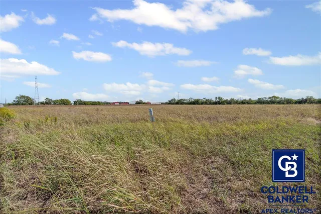 a view of a lake with sunset in background