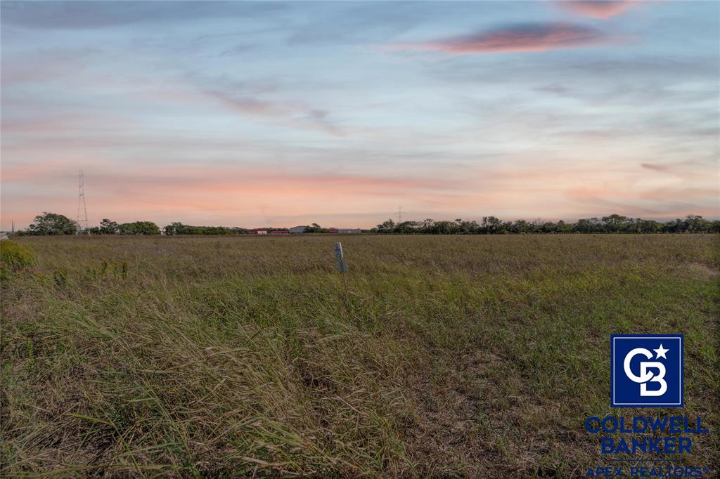 501 Hix Road Cleburne, TX 76031 - Photo 10 of 12 a view of a lake with houses in the back