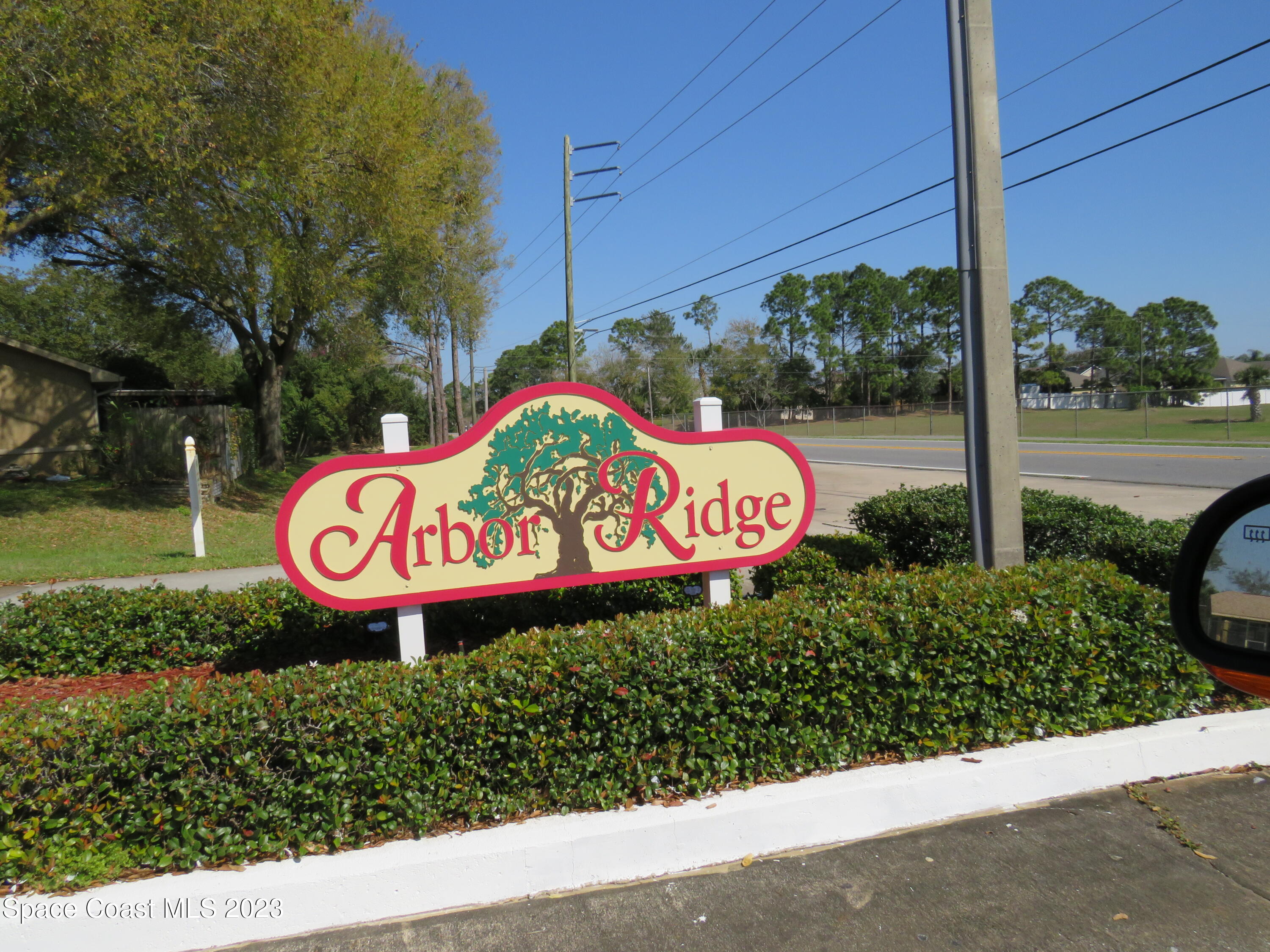 465 Arbor Ridge Lane Titusville, FL 32780 - Photo 13 of 13 a sign that is on the side of the road