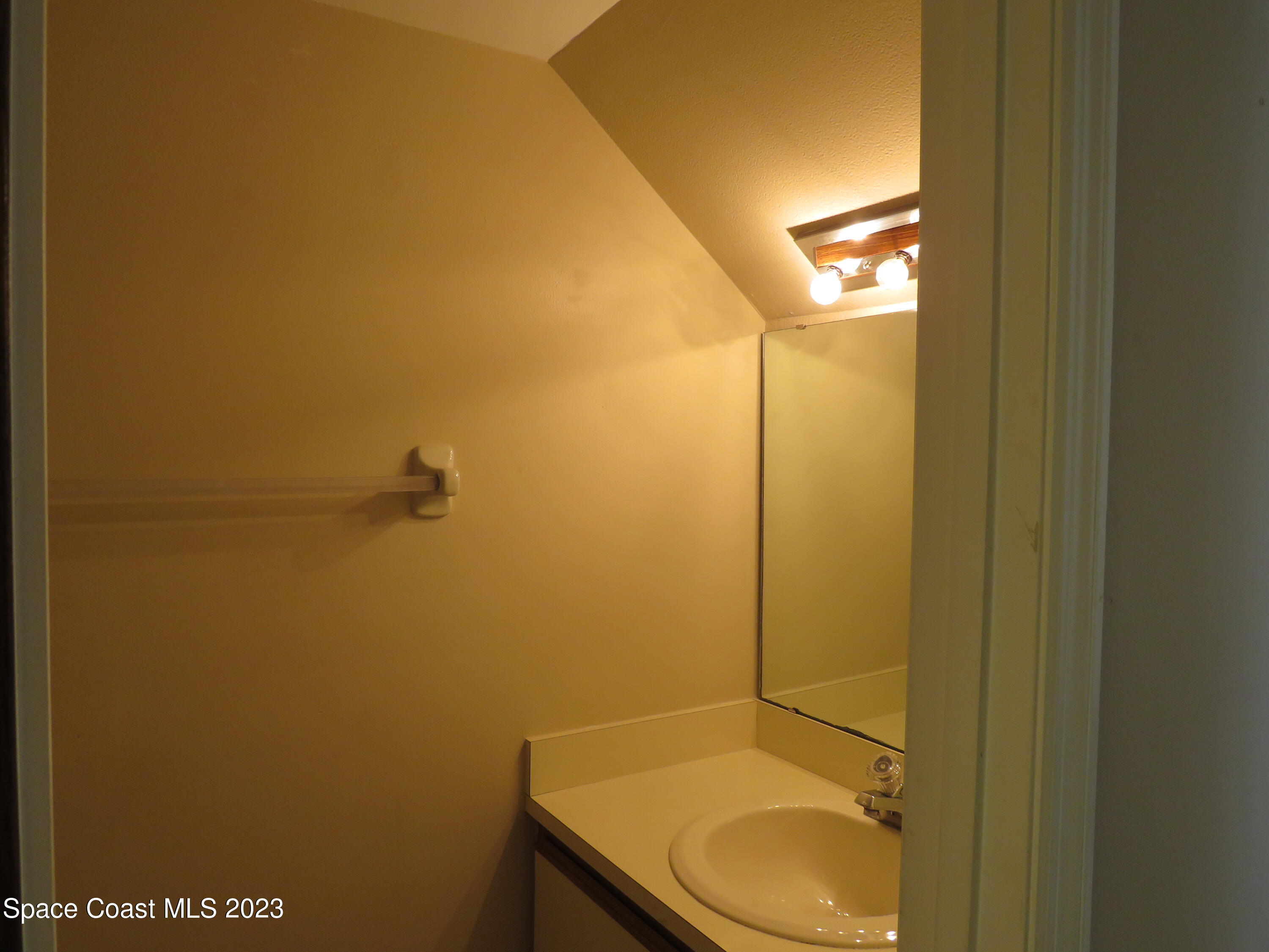 465 Arbor Ridge Lane Titusville, FL 32780 - Photo 5 of 13 a bathroom with a toilet and a sink