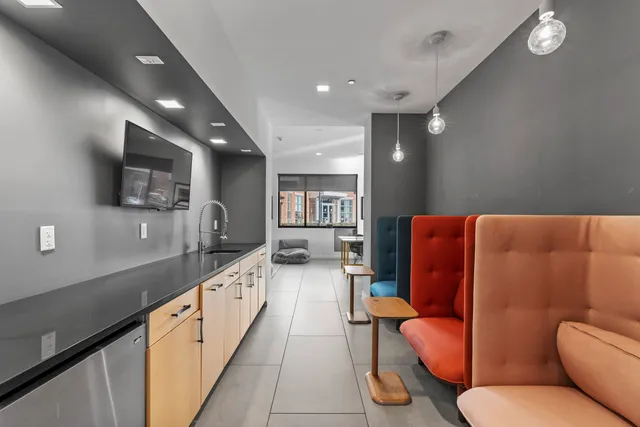 a large white kitchen with a large window