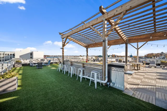 a view of a patio with a table and chairs