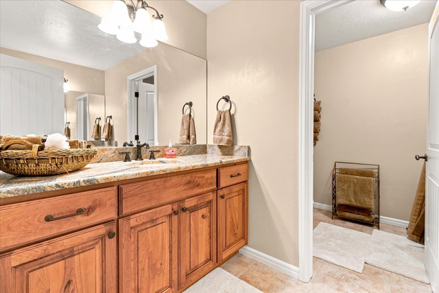 11290 South Southfield Road Mayfield, UT 84643 - Photo 88 of 103 Wood-finish vanity with granite countertop and undermount sink