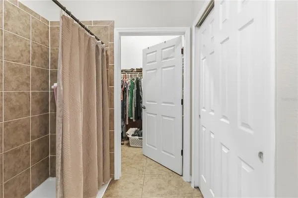 a view of an empty room with a closet