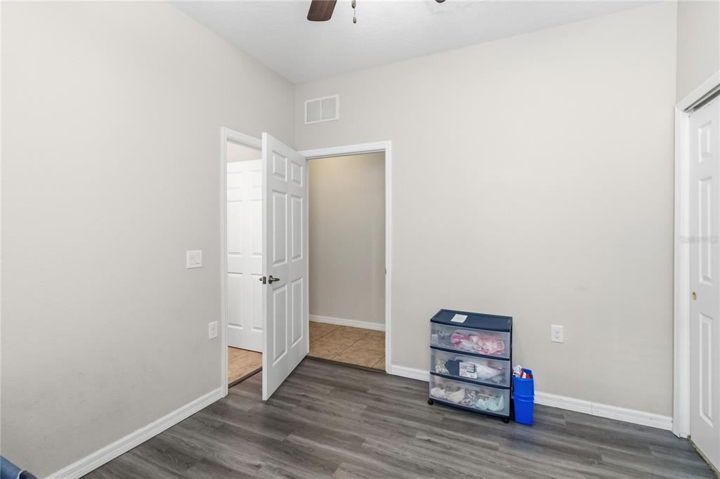 3430 Schoolhouse Road Harmony, FL 34773 - Photo 27 of 70 a view of a room with wooden floor