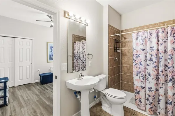 a bathroom with a shower curtain and a shower curtain