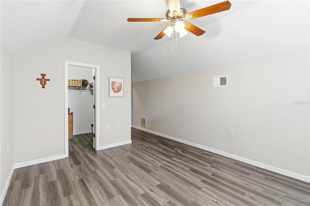 3430 Schoolhouse Road Harmony, FL 34773 - Photo 33 of 70 a view of an empty room with wooden floor