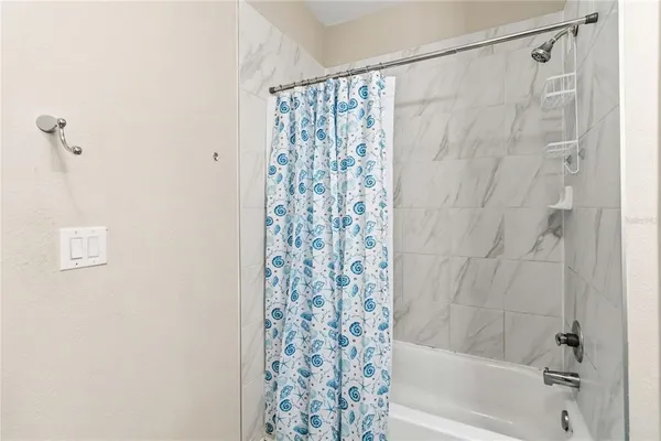 an aerial view of residential houses with outdoor space and swimming pool