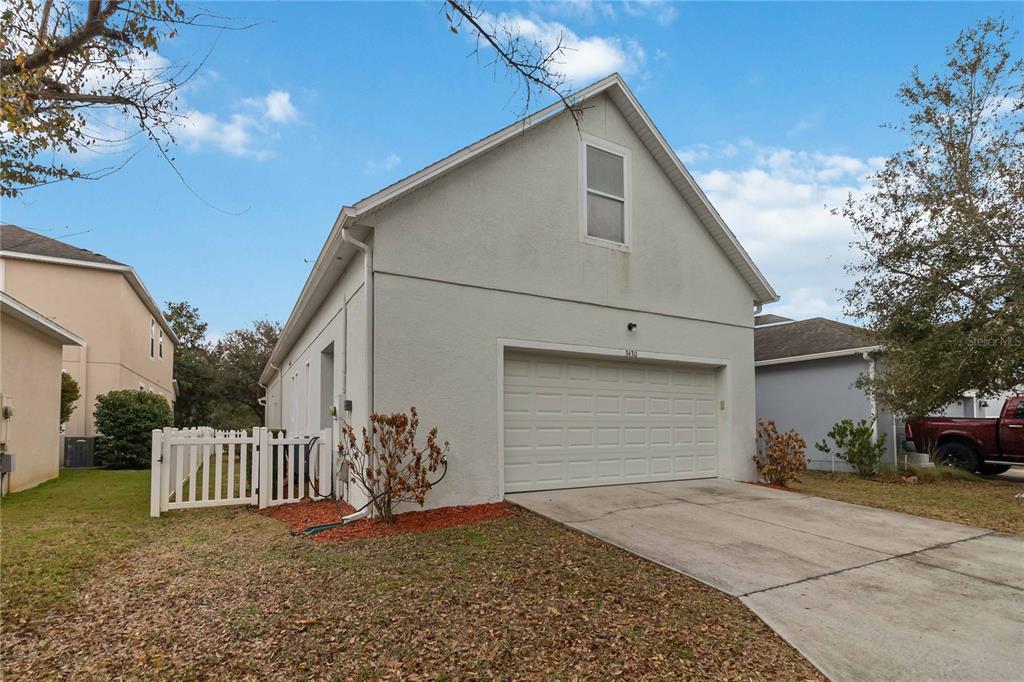 3430 Schoolhouse Road Harmony, FL 34773 - Photo 44 of 70 a view of a house with a yard