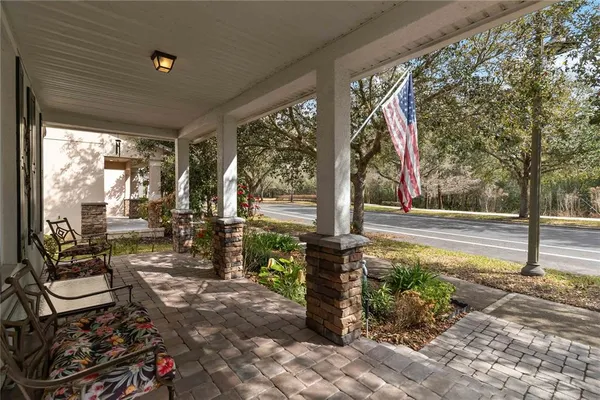 a living room with furniture a window and kitchen view