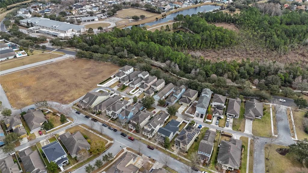 3430 Schoolhouse Road Harmony, FL 34773 - Photo 61 of 70 an aerial view of a city with lots of residential buildings