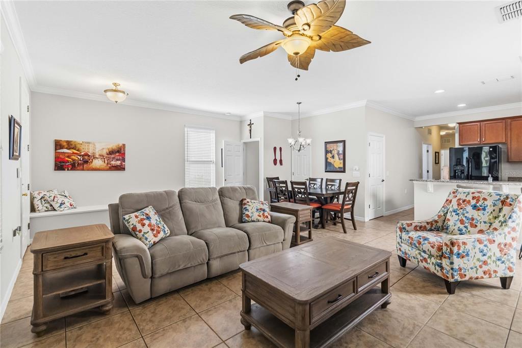 3430 Schoolhouse Road Harmony, FL 34773 - Photo 7 of 70 a living room with furniture and wooden floor