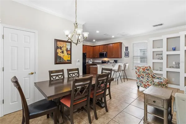 a kitchen with stainless steel appliances granite countertop a refrigerator sink and stove