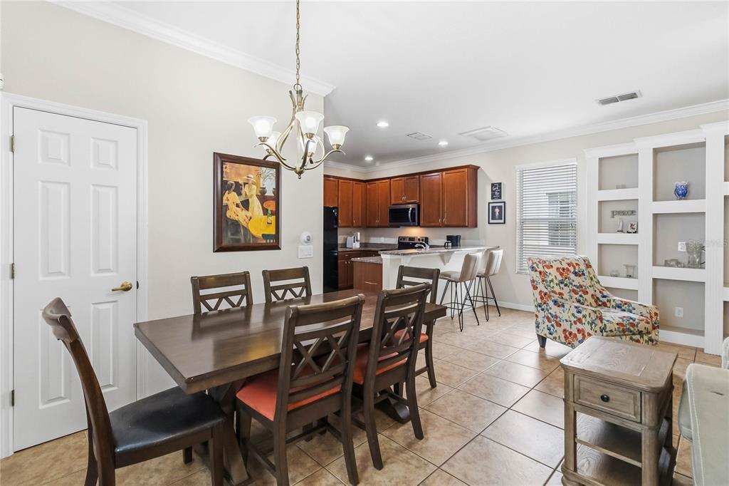 3430 Schoolhouse Road Harmony, FL 34773 - Photo 8 of 70 a view of a dining room with furniture
