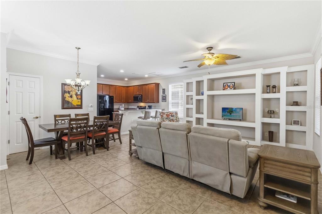 3430 Schoolhouse Road Harmony, FL 34773 - Photo 9 of 70 a living room with furniture a window and kitchen view