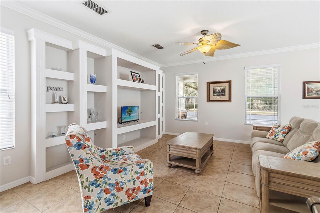 3430 Schoolhouse Road Harmony, FL 34773 - Photo 10 of 70 a living room with furniture and a flat screen tv