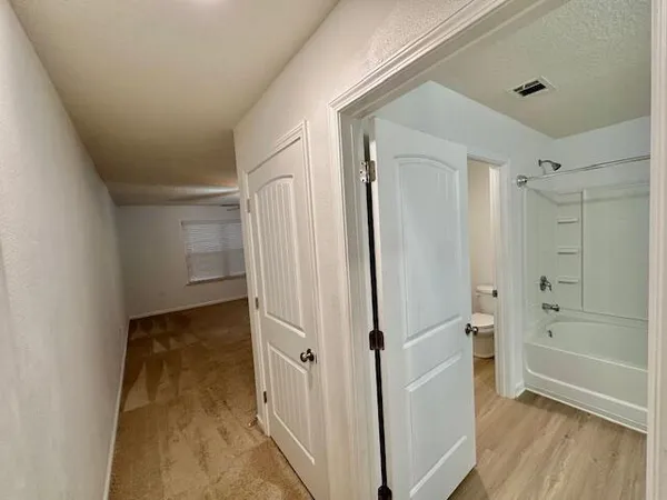 a view of a room with racks on the wall