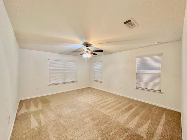348 Merlin Court Crestview, FL 32539 - Photo 12 of 40 an empty room with windows and ceiling fan view