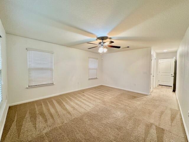 348 Merlin Court Crestview, FL 32539 - Photo 13 of 40 a view of an empty room with a chandelier fan