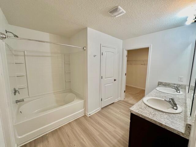 348 Merlin Court Crestview, FL 32539 - Photo 14 of 40 a bathroom with a granite countertop sink a mirror and a bathtub