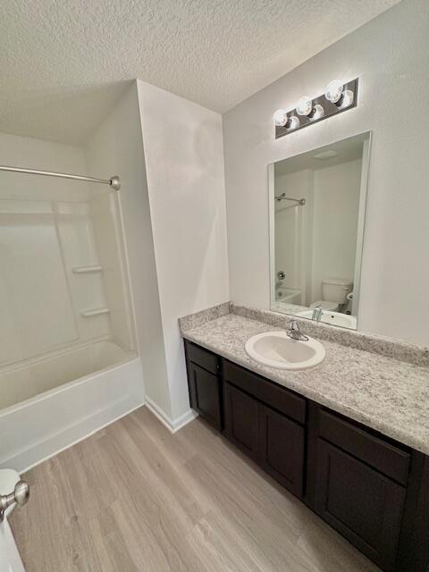 348 Merlin Court Crestview, FL 32539 - Photo 23 of 40 a bathroom with a granite countertop sink a mirror and a bathtub