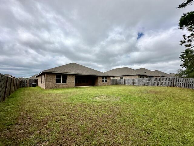 348 Merlin Court Crestview, FL 32539 - Photo 32 of 40 a big yard with large trees and wooden fence