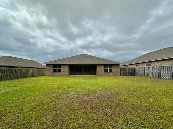a backyard of a house with lots of green space