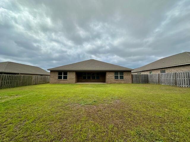 348 Merlin Court Crestview, FL 32539 - Photo 33 of 40 a backyard of a house with lots of green space