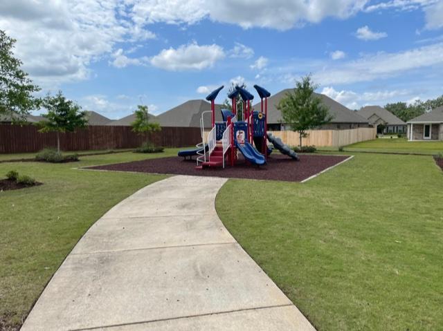 348 Merlin Court Crestview, FL 32539 - Photo 35 of 40 a view of a park with swings and slides