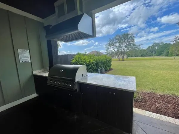 a view of a balcony with chair and table