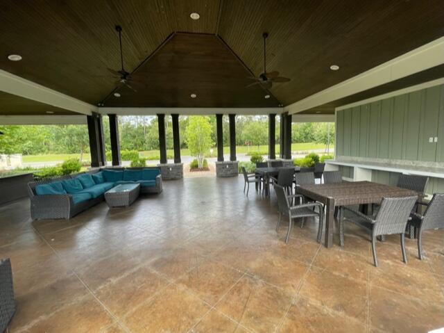 348 Merlin Court Crestview, FL 32539 - Photo 38 of 40 a view of a patio with table and chairs