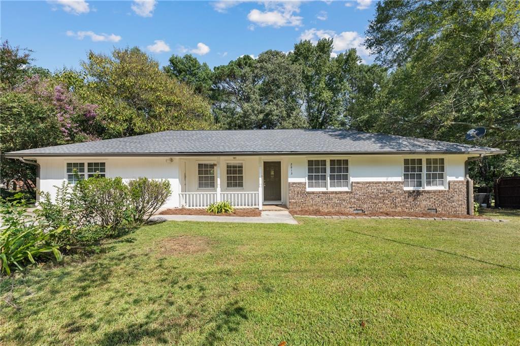 2813 Freemans Mill Road Dacula, GA 30019 - Photo 1 of 1 a front view of a house with a yard