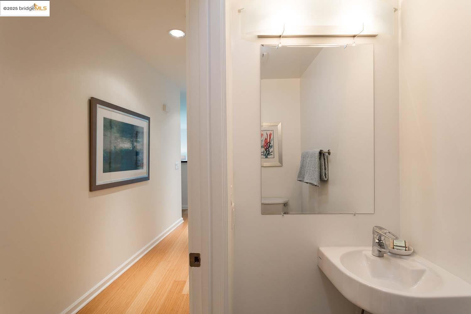 200 2nd Street, Unit 215 Oakland, CA 94607 - Photo 13 of 18 a bathroom with a sink and a mirror