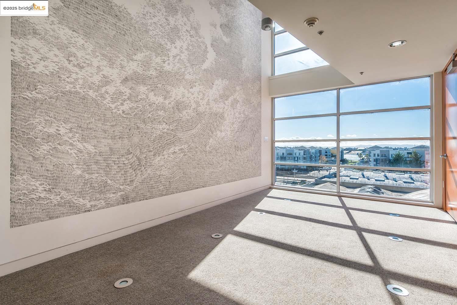 200 2nd Street, Unit 215 Oakland, CA 94607 - Photo 15 of 18 a view of a living room and a window