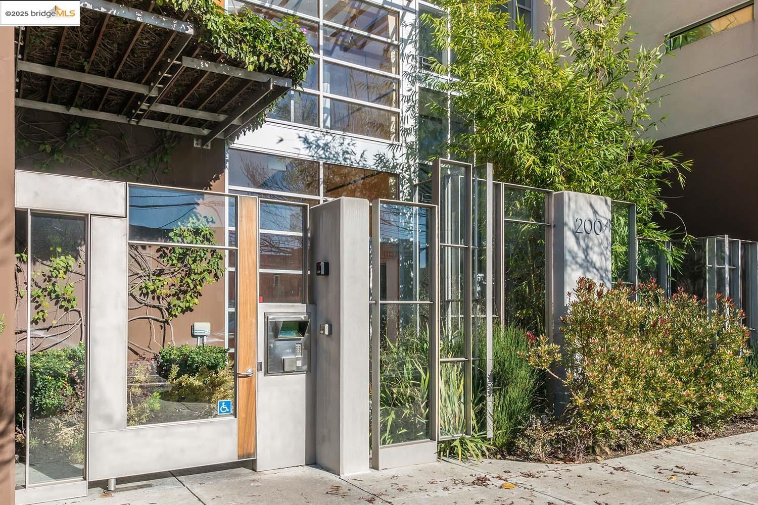 200 2nd Street, Unit 215 Oakland, CA 94607 - Photo 17 of 18 a view of a house with a windows and plants