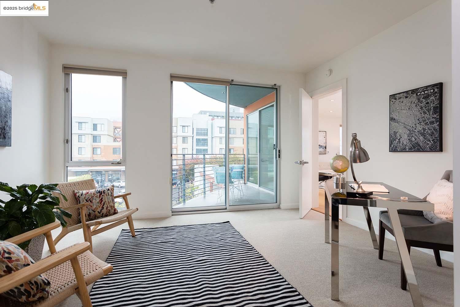 200 2nd Street, Unit 215 Oakland, CA 94607 - Photo 10 of 18 a bedroom with furniture and a window