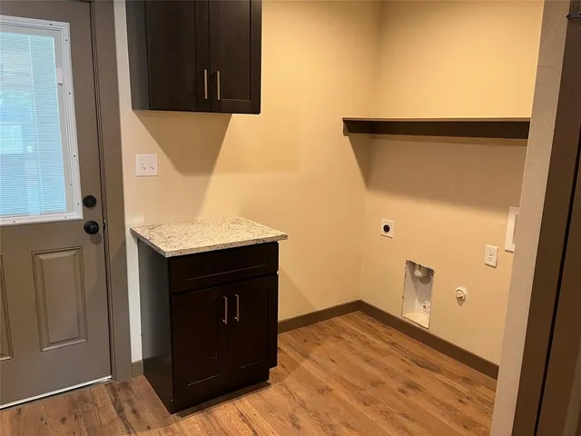a view of a kitchen from the hallway