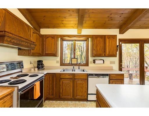 50 Deer Bay Road Ashby, MA 01431 - Photo 17 of 40 a kitchen with a sink stove and cabinets