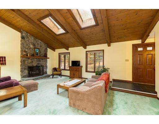 50 Deer Bay Road Ashby, MA 01431 - Photo 21 of 40 a living room with furniture and a fireplace